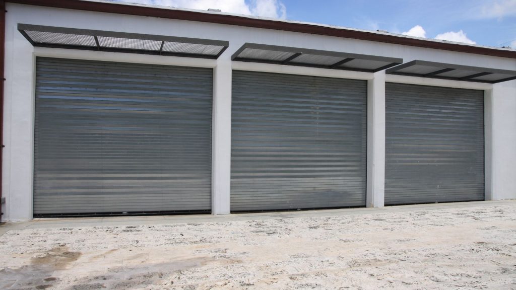 Three garage doors made of aluminum, one of the common garage door materials. 